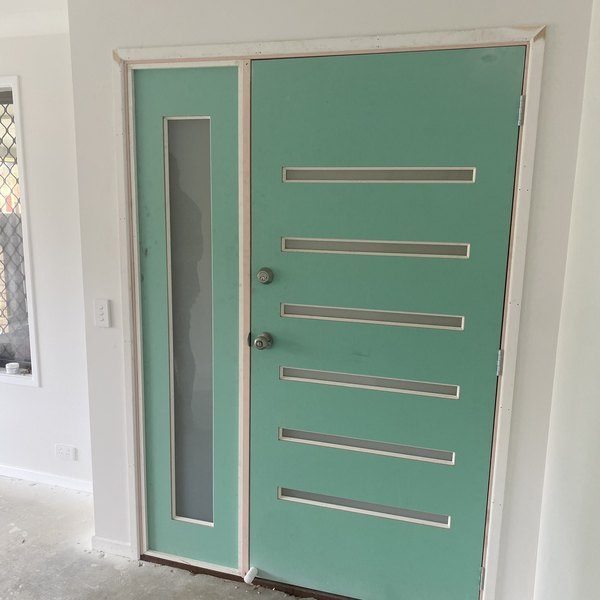 A newly hung timber-framed entry door